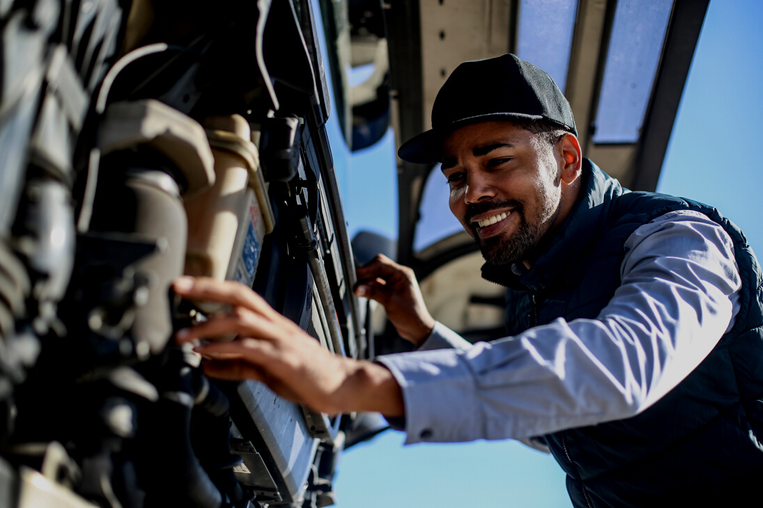 Mechanic repairing a truck engine