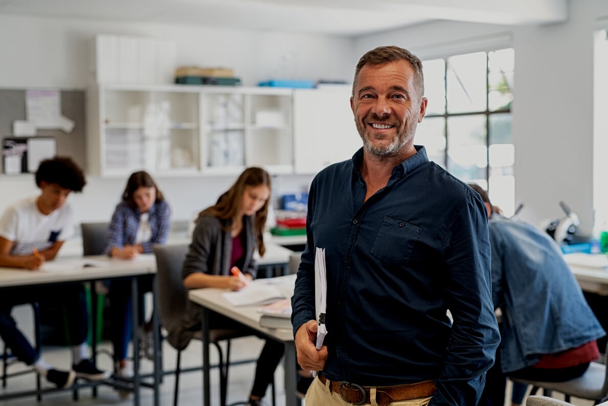 Mature Male Professor Standing in Class